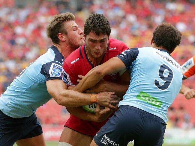 Rob Simmons charging onto NSW defenders. Picture: Peter Wallis