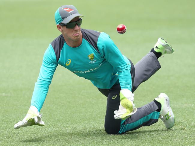 Tim Paine juggles a catch during an Australian training session at the Gabba. Picture: AAP