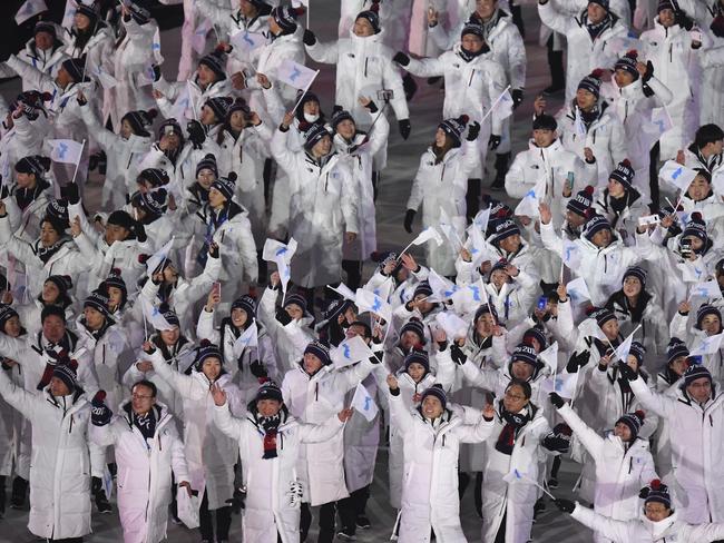 North Korean and South Korean athletes arrive together for the first time in 11 years. Picture: Franck Fife/Pool Photo via AP.