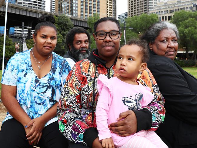 5/9/18: Mum Patricia Mooka, (Mum), Thomas Mooka with Adimin Mooka holding her child, Bawanab and Cassandra Mooka in the blue top at Circular Quay in Sydney. Adimin Mooka graduated from St Saviour's College Toowoomba on an Australian Indigenous Education Foundation scholarship in 2014. Her younger sister Cassandra graduated last year.  Adimin works as an Administration Officer for the Torres Strait Island Regional Council and Cassandra is engaged in casual retail work on Dauan Island. They are visiting Sydney with their parents for a 10-year gala celebration with theprogramÕs graduates on Thurs night. John Feder/The Australian.