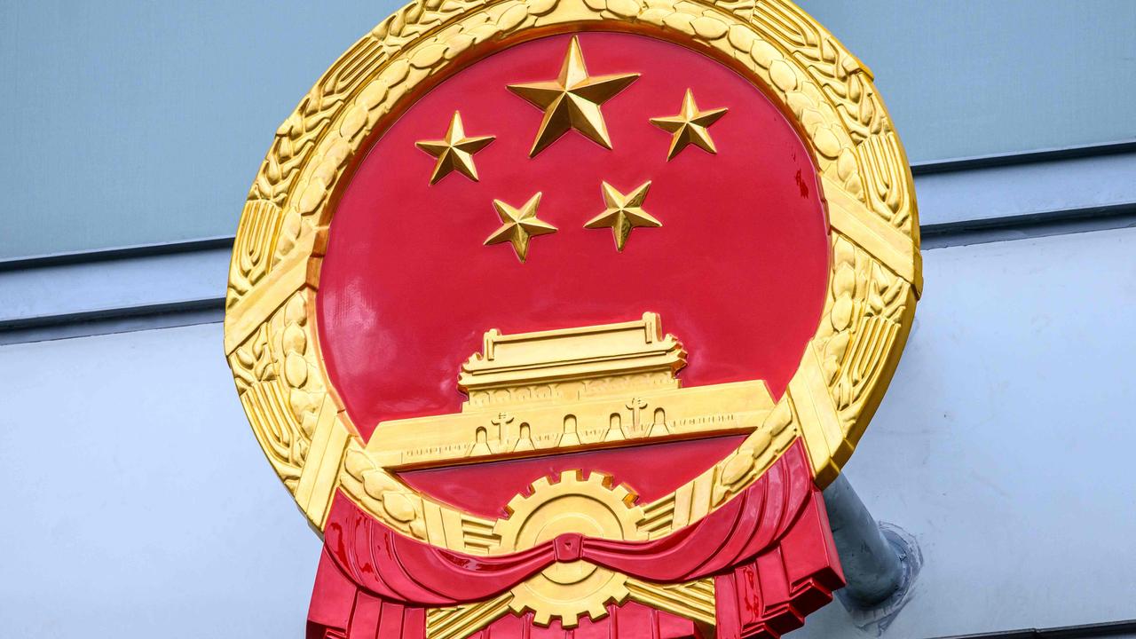 A Chinese national emblem is seen displayed outside the new Office for Safeguarding National Security in Hong Kong. Picture: Anthony Wallace/AFP