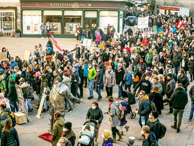 People take part in a march protecting against the Covid-19 restrictions in Salzburg, Austria on Sunday. Picture: AFP