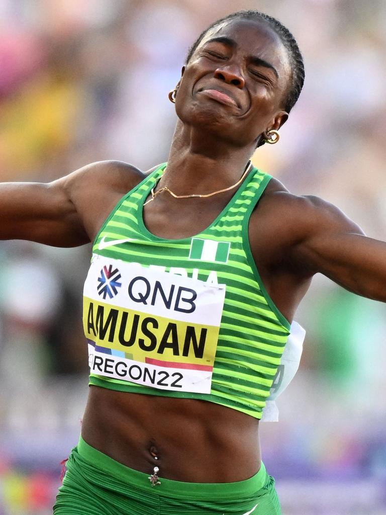 Nigeria's Tobi Amusan celebrates setting a world record. Photo by Jewel SAMAD / AFP.