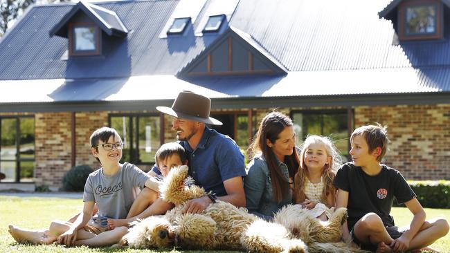 Cameron and Ashley Marshall, with kids Riley, Austin, Bridie and Carter, are selling their Yerrinbool home that shot up in value. Picture: Sam Ruttyn