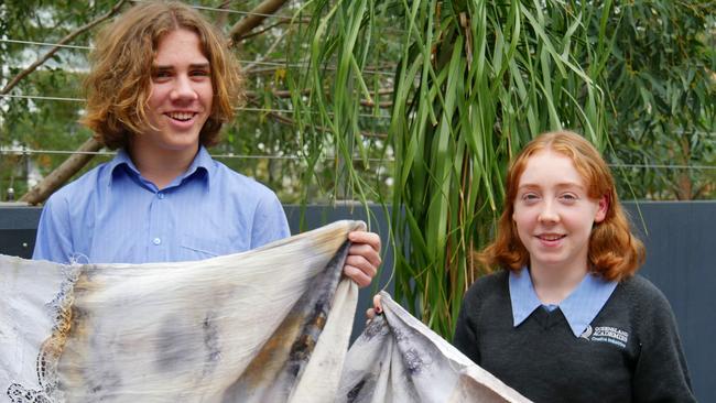 QACI students James Cartwright and Indio Stuart with their eco-dyed fabrics made for Green the Street at the EKKA. Photo. supplied