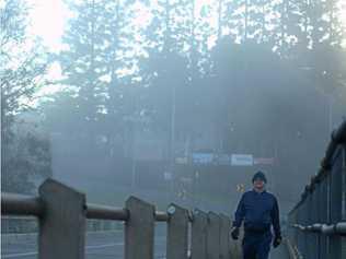 DEDICATED: Peter Bosse, crossing Kidd Bridge, went for his regular morning walk despite the plummeting temperatures. Picture: Frances Klein