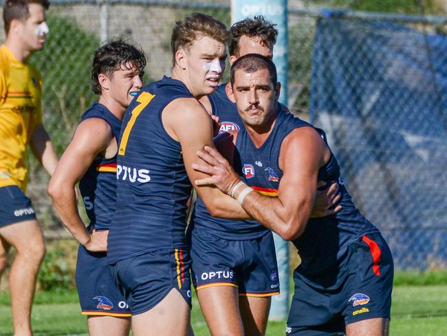 Riley Thilthorpe shows off his size against Taylor Walker. Picture: Brenton Edwards