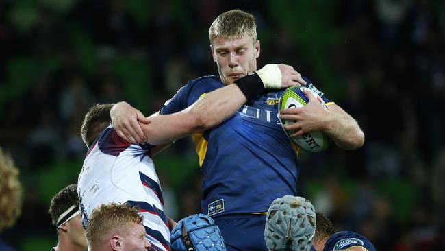 Brumbies lock Tom Staniforth secures a lineout under pressure from Rebels flanker Adam Thomson.