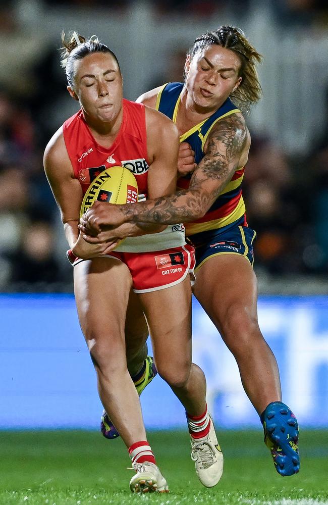 Paige Sheppard of the Swans tackled by Anne Hatchard of the Crows. Picture: Mark Brake / Getty Images