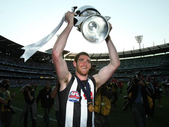 2010 AFL Grand Final Replay, Collingwood Magpies v St Kilda Saints, at the MCG in Melbourne. Collingwood players celebrate after their victory over St Kilda. Tyson Goldsack with the Premiership Cup.