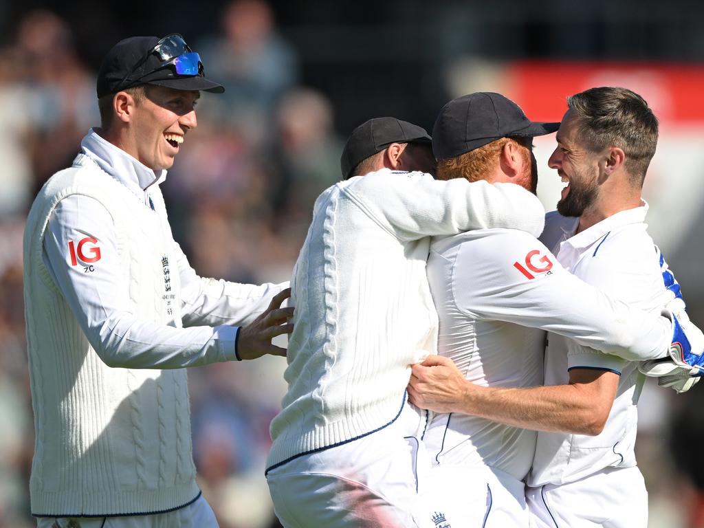 Chris Woakes hugs Jonny Bairstow after his catch to remove Mitch Marsh. Picture: Stu Forster/Getty Images.