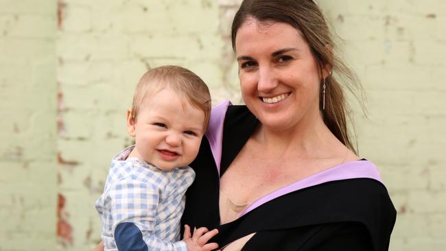 Master of Physiotherapy graduate Larissa Brake with her eight-month son Charlie Cook at the University of Tasmania 2024 Winter Graduations ceremony in Launceston. Picture: Stephanie Dalton