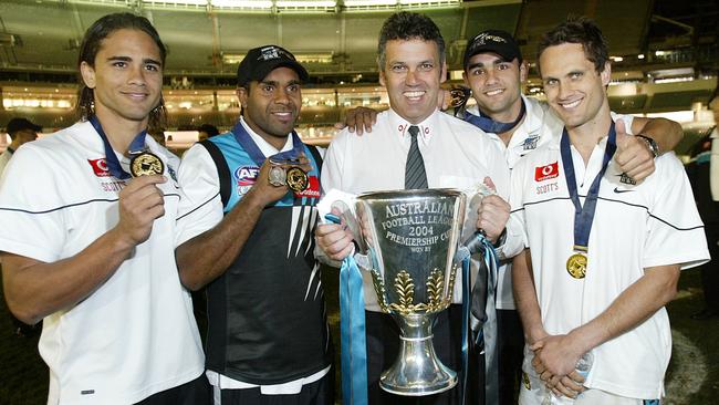 Peter Burgoyne (left), Byron Pickett, coach Mark Williams, Shaun Burgoyne and Gavin Wanganeen after the Power’s 2004 grand final victory.