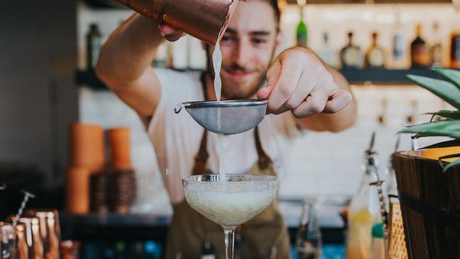 The Collective Palm Beach staff straining and making cocktail drink. Picture: Supplied/Destination Gold Coast