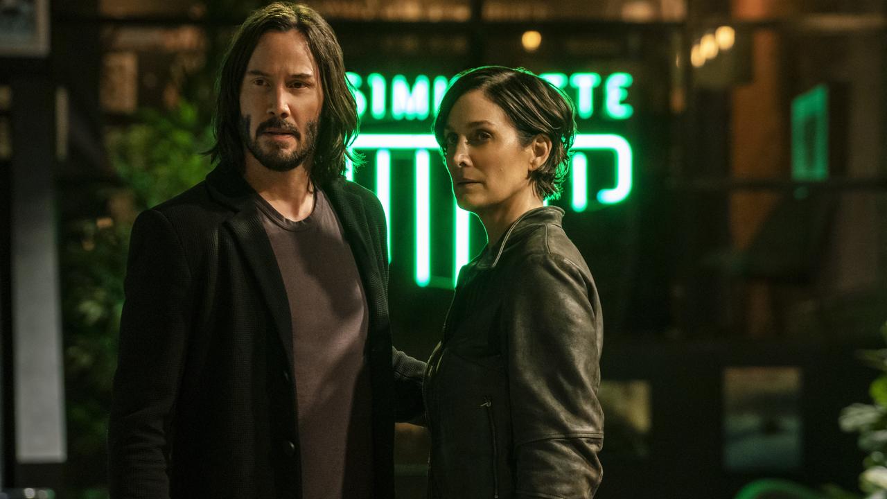 Keanu Reeves and Carrie-Anne Moss reunite in The Matrix Resurrections. Picture: Warner Bros