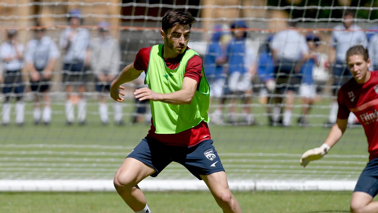 Josh Cavallo at training with his Adelaide United teammates at St Peters College. Picture: Naomi Jellicoe