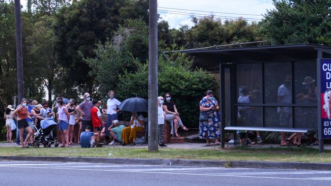 Lismore Base Hospital Covid testing clinic queue trickling around the corner into Hunter street.