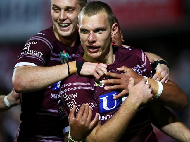 SYDNEY, AUSTRALIA - AUGUST 17: Tom Trbojevic of the Sea Eagles celebrates with his team mates after scoring a try during the round 23 NRL match between the Manly Sea Eagles and the Gold Coast Titans at Lottoland on August 17, 2018 in Sydney, Australia. (Photo by Mark Kolbe/Getty Images)