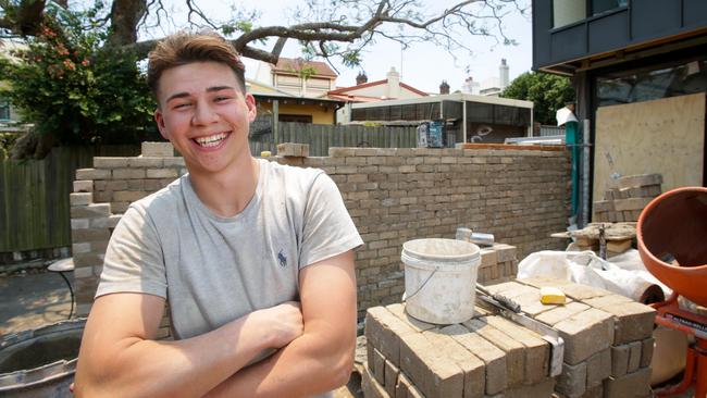 Bricklayer Archie Rudge working on a building site in Newtown. Picture: Liam Driver