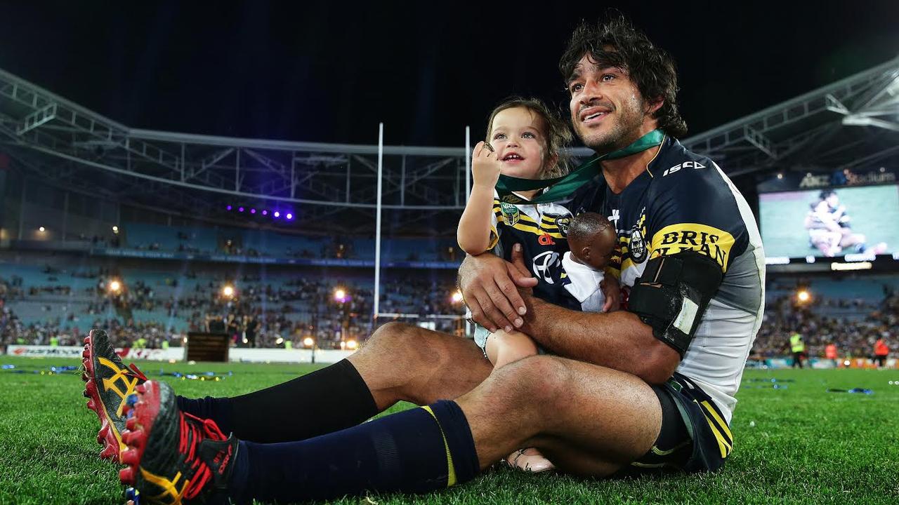 Johnathan Thurston with his daughter Frankie after winning the premiership. Picture: Brett Costello