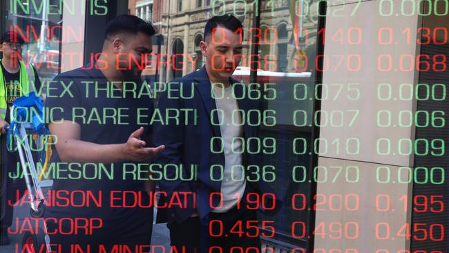 ????SYDNEY, AUSTRALIA : NewsWire Photos - FEBRUARY 24 2025; A general view of people walking past the digital boards of the ASX in the Sydney CBD. Picture: NewsWire/ Gaye Gerard