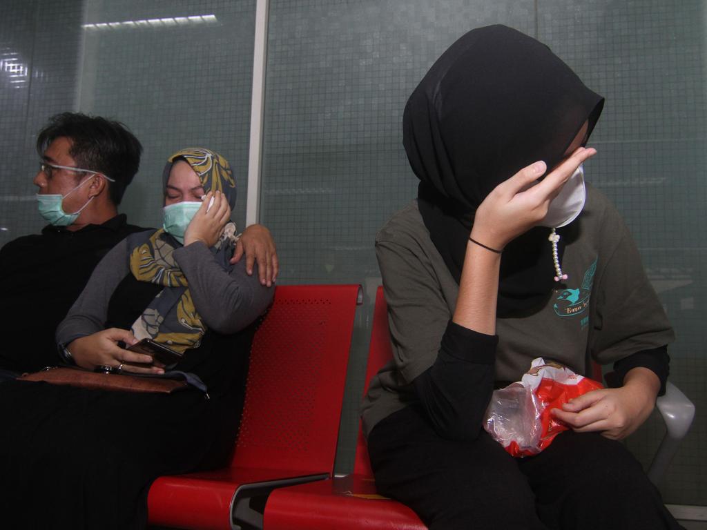 Relatives of passengers on board missing Sriwijaya Air flight SJ182 wait for news at the Supadio airport in Pontianak on Indonesia's Borneo island on January 9, 2021, after contact with the aircraft was lost shortly after takeoff from Jakarta. Picture: Louis Anderson / AFP