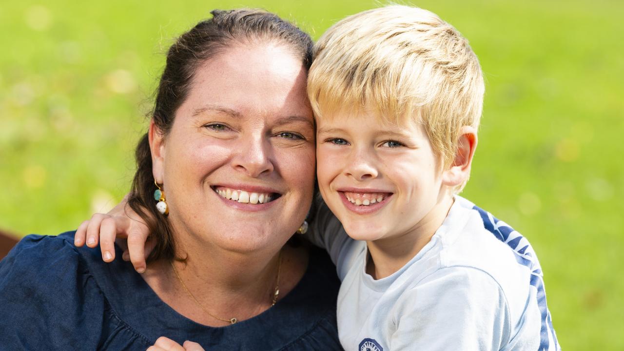 Pax Howden gives mum Claire Howden a hug for Mother's Day during celebrations in the Queensland State Rose Garden, Newtown Park, Sunday, May 8, 2022. Picture: Kevin Farmer