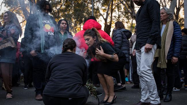 Senator Lidia Thorpe takes part in a traditional smoking ceremony during a vigil held for teenage assault victim Cassius Turvey at the Aboriginal Advancement League in Melbourne.