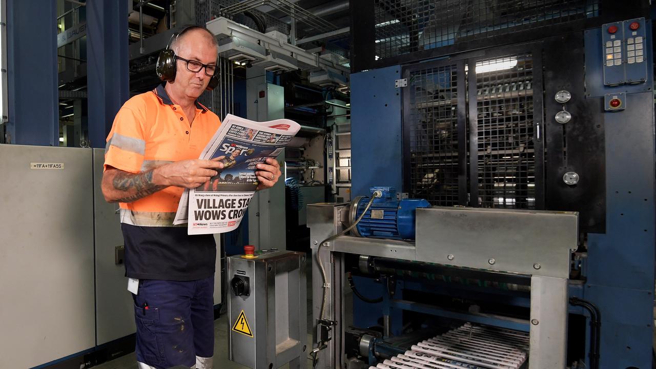 Press operator Michael O’Neill checks the paper for mistakes during the printing process. Pictures: KERI MEGELUS