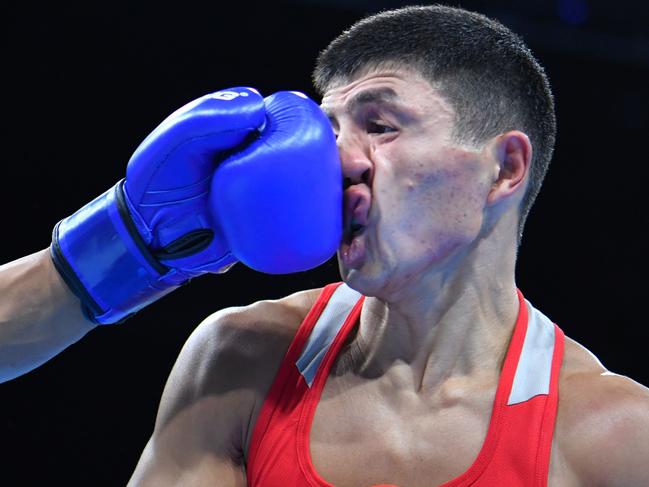 USA's Carlos Zenon Balderas Jr. lands a punch on Kazakhstan's Berik Abdrakhmanov during the Men's Light (60kg) match at the Rio 2016 Olympic Games at the Riocentro - Pavilion 6 in Rio de Janeiro on August 6, 2016. / AFP PHOTO / Yuri CORTEZ