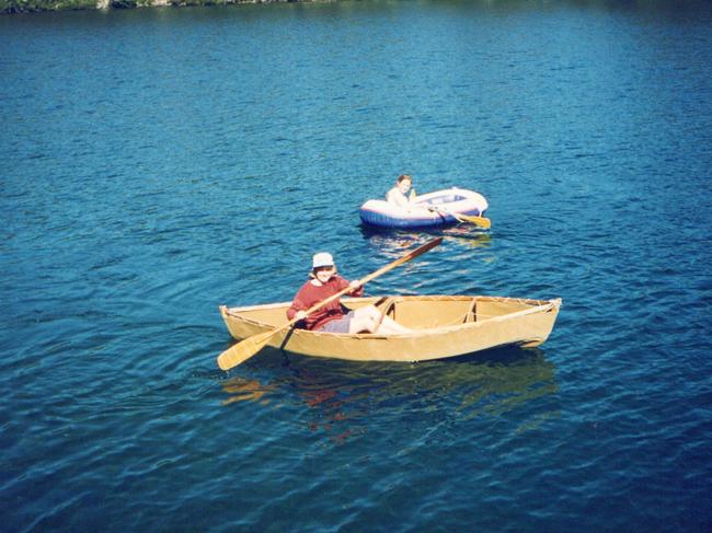 Liz McQuilkin on Lake Malbena near Halls Island in 1992, in a portable canoe built by Reg Hall and now being restored and put in safe keeping at the Queen Victoria Museum and Art Gallery, Launceston. Picture: SUPPLIED