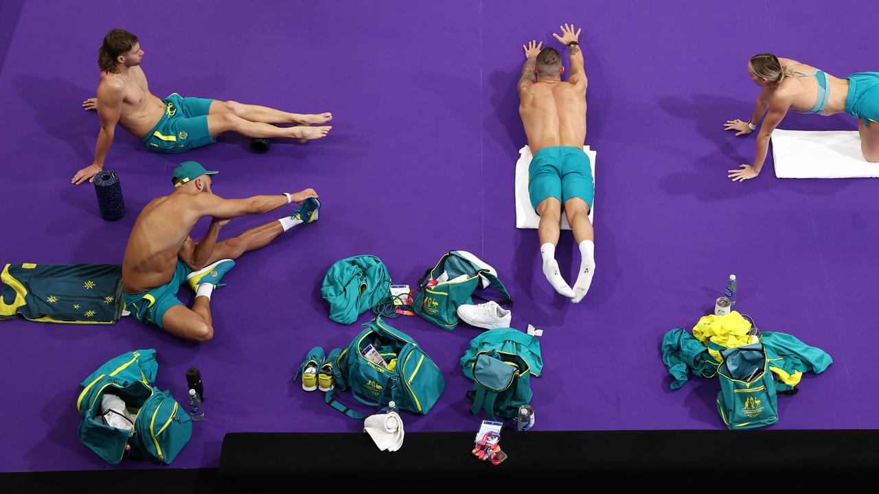 Aussie swimmers warm up on the pool deck Picture; Michael Klein