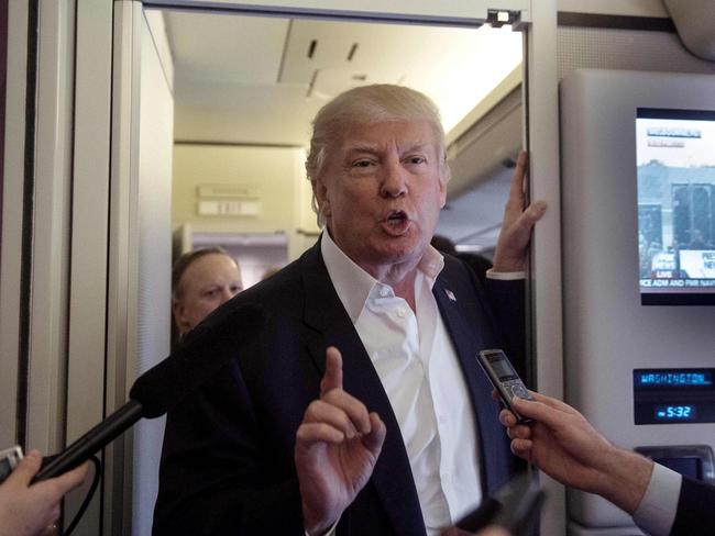 Mr Trump speaks to the press aboard Air Force One before addressing a rally in Melbourne, Florida, on Saturday. Picture: Nicholas Kahm/AFP