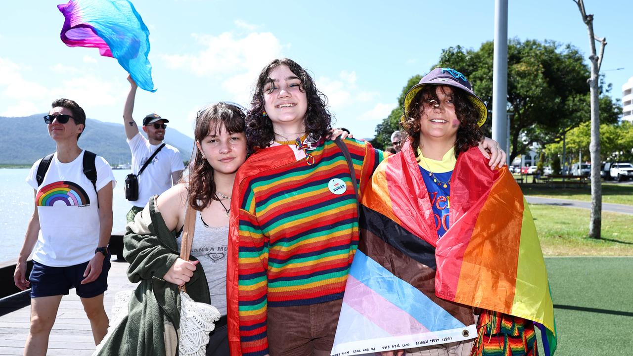 Zahra Quaid, Sienna Hunter and Mia Lewry march along the Cairns Esplanade for the Pride Stride on Saturday, part of the 2024 Cairns Pride Festival. Picture: Brendan Radke