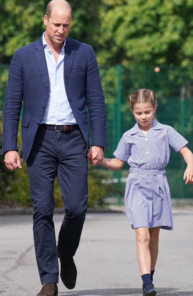 William held hands with Charlotte as he escorted her to school. Picture: Jonathan Brady/Getty Images