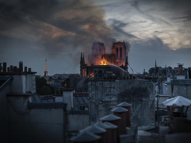 Flames and smoke are seen billowing from the roof at Notre-Dame Cathedral on April 15, 2019 in Paris, France. (Photo by Veronique de Viguerie/Getty Images)