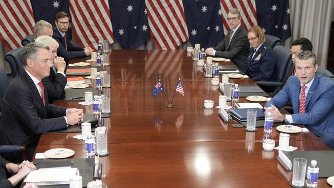 Mr Marles and Mr Hegseth talk with reporters at the meeting. Picture: Oliver Contreras / AFP)