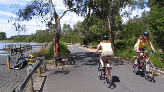 Cycling past the lake at Jells Park in Wheelers Hill.