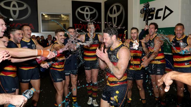 Sam Gibson gets a Gatorade shower for his first win in Crows colours after their win against the Western Bulldogs at the Adelaide Oval on Friday. Picture: James Elsby/AFL Media/Getty Images