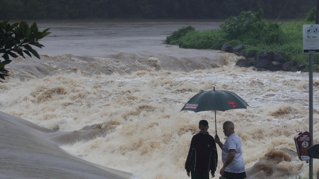 Roaring floodwaters at Oxenford Weir. Picture: Glenn Hampson