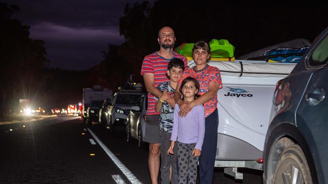 Luke Napoleone and Jaclyn Paltos with kids May, 7 and Lenny, 10 rushed back from Eden before the border closed. Picture: Jason Edwards