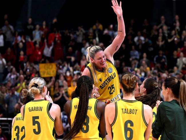 Australia's Lauren Jackson (C) is lifted in the air by teammates after victory in the 2022 Women's Basketball World Cup bronze medal game between Australia and Canada at the Superdome on October 1, 2022, in Sydney. (Photo by William WEST / AFP) / --IMAGE RESTRICTED TO EDITORIAL USE - NO COMMERCIAL USE--