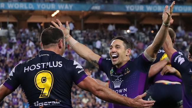 Billy Slater celebrates NRL grand final victory with Cameron Smith.