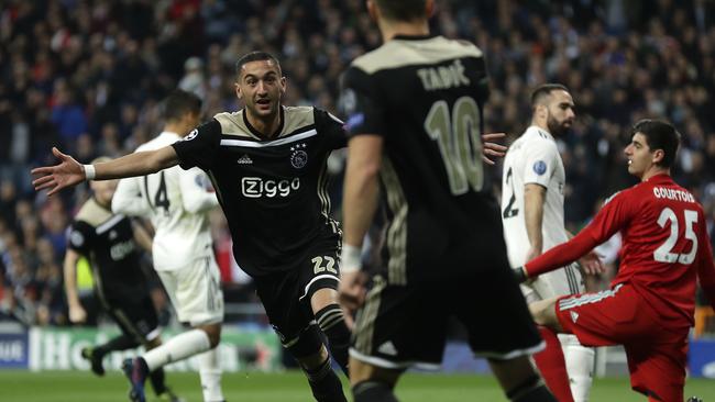 Jubilation! Ajax's Hakim Ziyech celebrates scoring the opening goal in the epic Champions League upset.