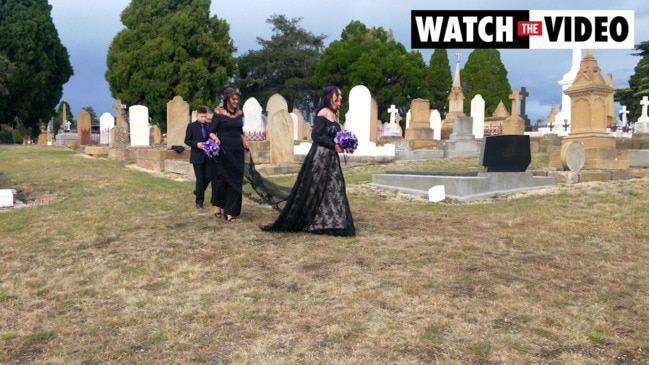 Couple ties knot in gothic cemetery wedding