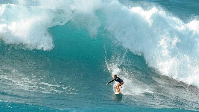 WUNDERKIND: Noosa 13-year-old Amarnie Barber shredding a monster at Waimea Bay in Hawaii. Picture: Craig Barber