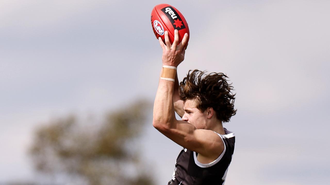 Aaron Cadman flies to take a grab. Picture: Jonathan DiMaggio/AFL Photos/via Getty Images