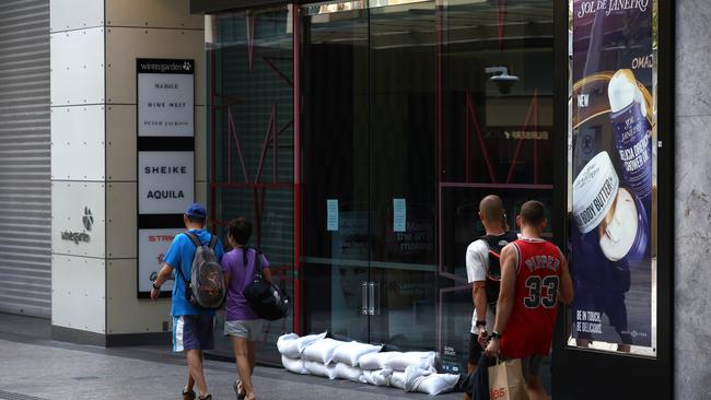 A sandbagged shop in the Queen St Mall. Picture: David Clark