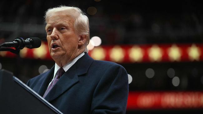 US President Donald Trump speaks during the inaugural parade inside Capital One Arena, in Washington, DC, on January 20, 2025. (Photo by Jim WATSON / AFP)