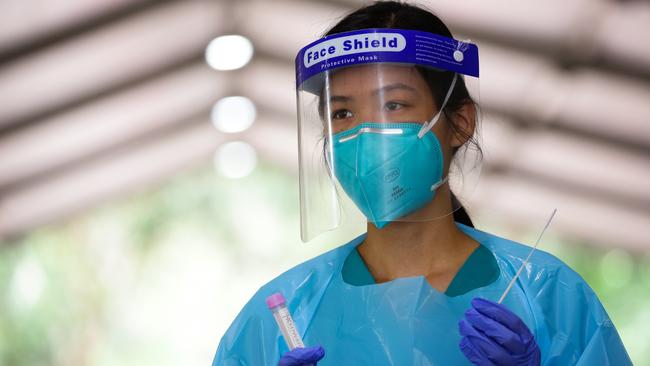 A nurse is seen with testing equipment at the Warringah Aquatic Club pop up drive-through testing clinic. Picture: NCA NewsWire / Gaye Gerard